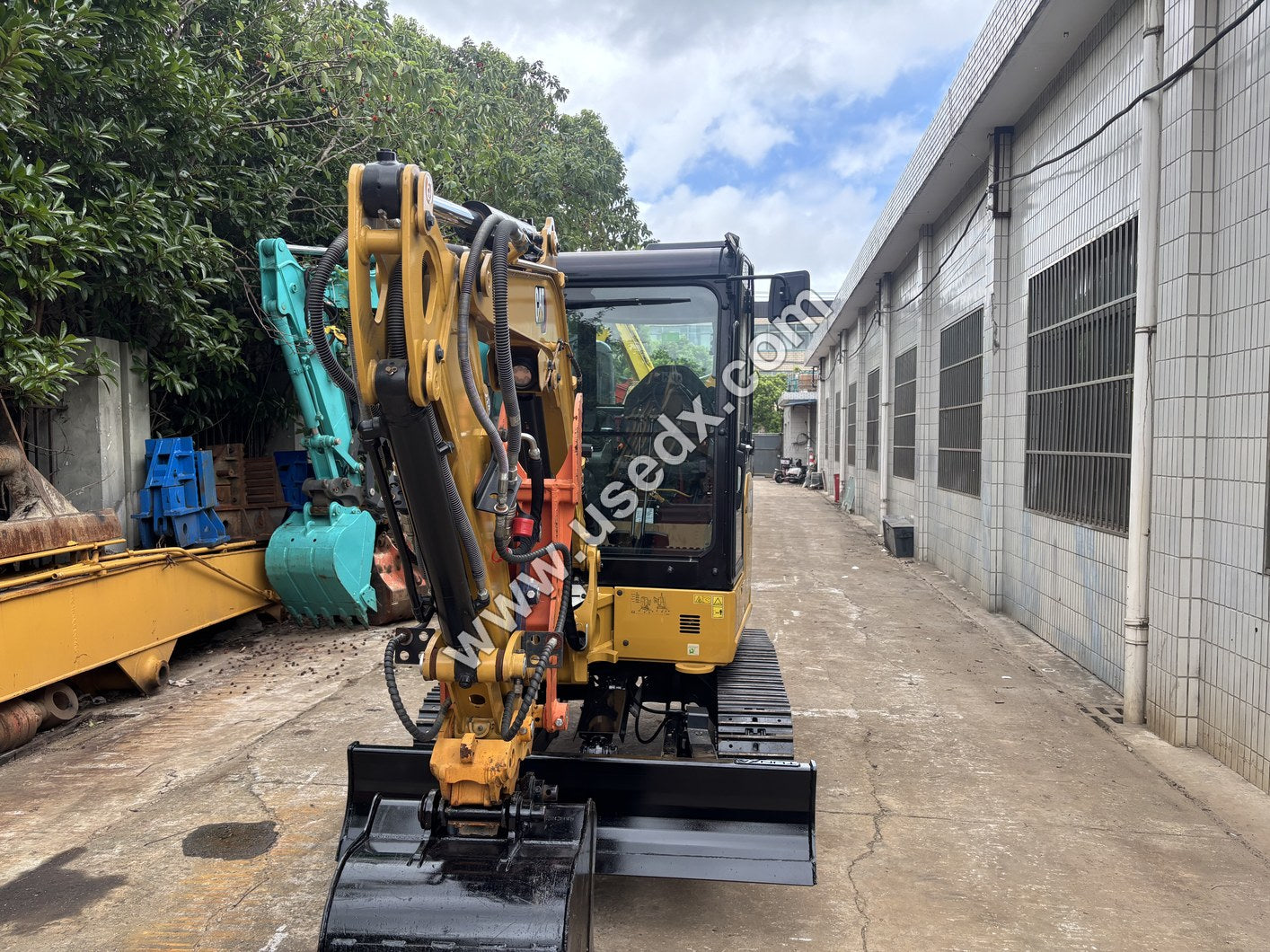 CAT 303E | four-way dozer blade